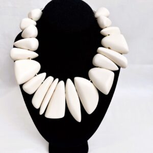 Unique shapes of ivory color resin beads.  The chunky beads have a matt finish, and each bead is different. 