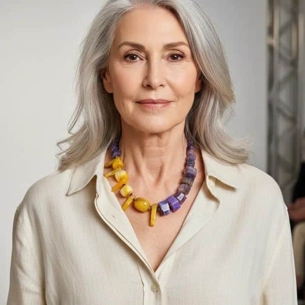 Natural Stone Necklace 0369009. Radiate confidence and individuality with this one-of-a-kind Purple & Yellow Agate Necklace, a celebration of natural beauty and vivid design. Featuring a striking combination of deep purple and bright yellow agate stones, this handcrafted natural stone necklace creates an elegant contrast that catches the eye and uplifts the spirit. Each stone is carefully selected and arranged to maximize visual impact, resulting in a festive and sophisticated necklace. Measuring 18 inches in length, the stone necklace rests gracefully along the neckline, perfectly proportioned for everyday elegance or special occasions. The natural agate stones, rich with unique patterns and translucent depth, tell their own story. Agate was first discovered by the ancient Greek philosopher Theophrastus in the Dirillo River of Sicily—then known as Acate—and has long been valued for its grounding energy and timeless beauty. This stunning natural stone necklace is perfect for adding a touch of elegance to any outfit. This piece isn’t just jewelry—it’s wearable history and vibrant artistry in one. With only a single necklace available, you’ll be wearing a truly exclusive treasure that reflects your distinctive style. Whether you choose it for its vibrant palette, its historical connection, or its rare availability, this necklace is sure to become a beloved highlight in any collection. Bold, radiant, and utterly unique.