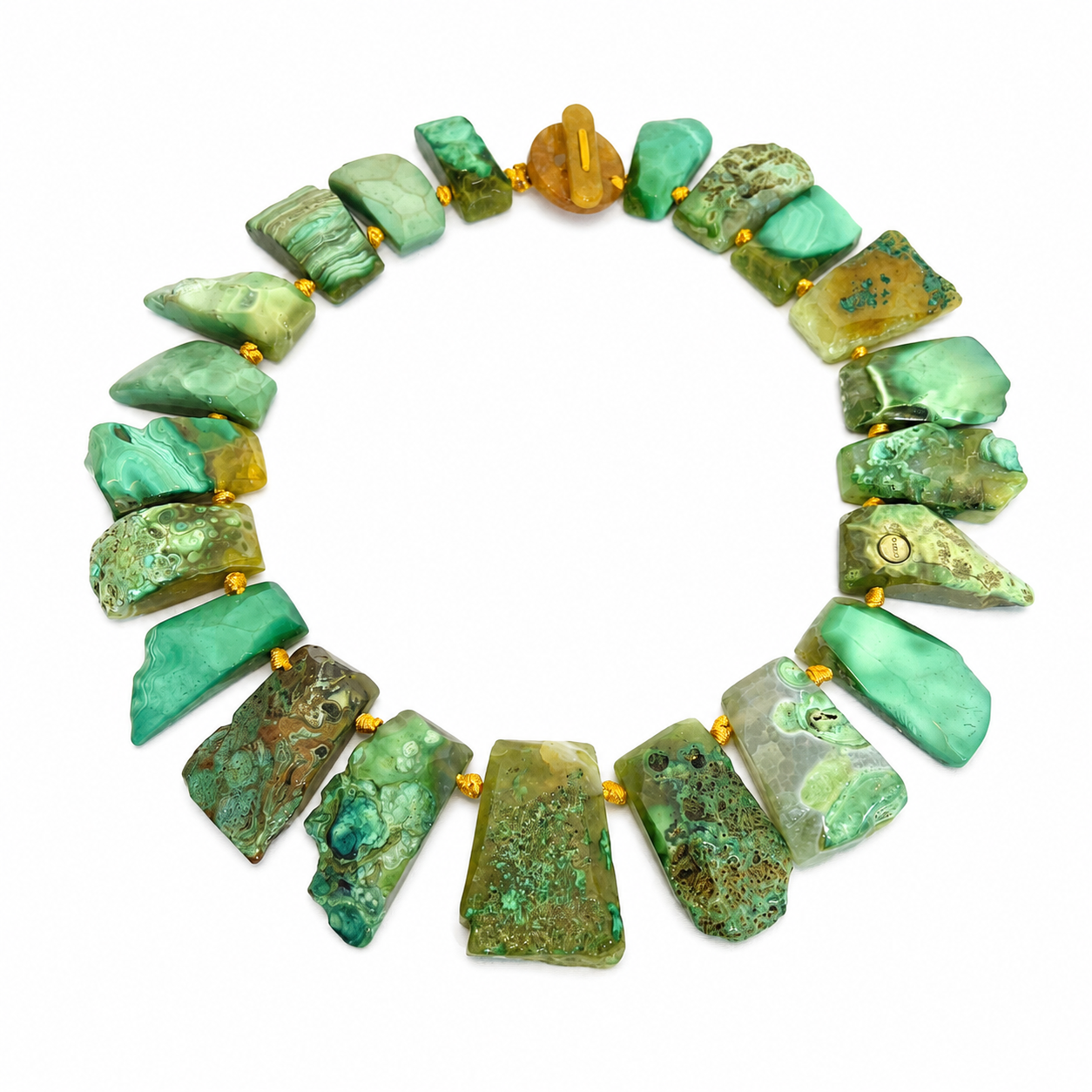 Handcrafted necklace featuring irregular polished green agate stones in varying shades of mint and moss, accented with golden cord. The design highlights organic texture and artisanal craftsmanship.