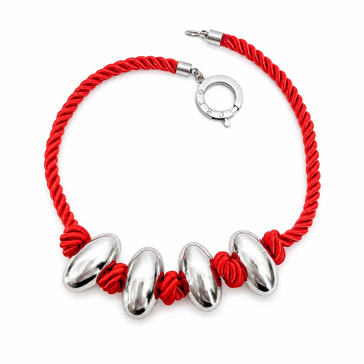 Handcrafted necklace featuring a twisted red cord with four polished silver‑tone oval beads and a circular silver clasp engraved “Caro.” The design highlights minimalist elegance and modern craftsmanship.