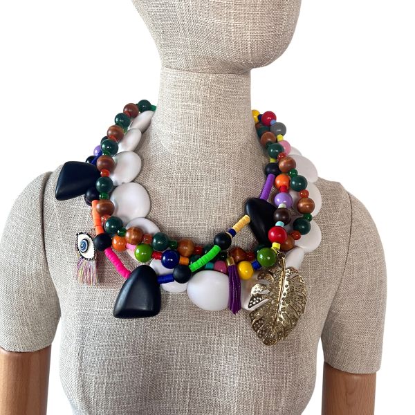 Multicolor Four‑Strand Beaded Necklace – 24 Inches, Toggle Clasp A vibrant celebration of color and craftsmanship, this four‑strand necklace brings expressive energy to any wardrobe. Designed with an eclectic mix of multicolor beads—smooth, faceted, matte, and glossy—it creates a layered silhouette that feels bold, artistic, and full of movement. The rich palette echoes the joyful spirit of Mardi Gras while remaining versatile enough for everyday wear. Measuring 24 inches in length, the necklace drapes gracefully along the neckline, offering a substantial yet comfortable presence at 15 ounces. Each strand is arranged to create balance and flow, allowing the colors and textures to interact in a way that feels curated and dynamic. A polished toggle clasp completes the design, making it easy to fasten while adding a touch of metallic shine. This statement piece is ideal for anyone who loves jewelry with personality—pieces that feel collected, meaningful, and joyfully unexpected. Whether paired with a simple top or layered into a more expressive ensemble, it instantly becomes the focal point. Its spirited mix of hues and textures brings a sense of celebration to your style, offering a wearable nod to the artistry and vibrancy of Mardi Gras without overwhelming the look. A perfect choice for those who appreciate handcrafted detail and the lively rhythm of Mardi Gras‑inspired design.