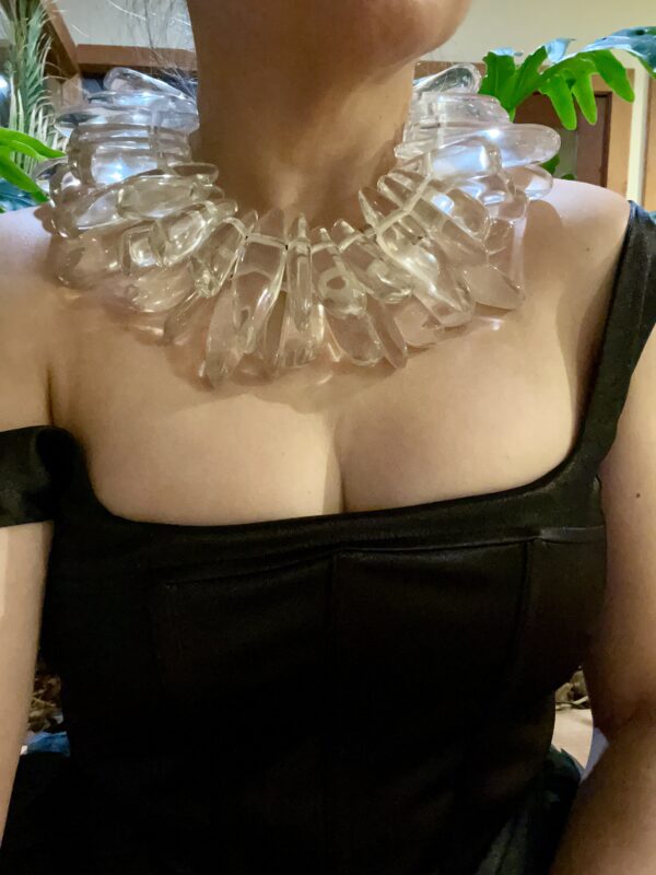 The necklace is made of two strands of irregular-shaped clear resin beads giving the illusion of icicles.   A spectacular piece of art that you can wear to a memorable occasion.  The necklace is 16 inches long and weighs 1.10 pounds.