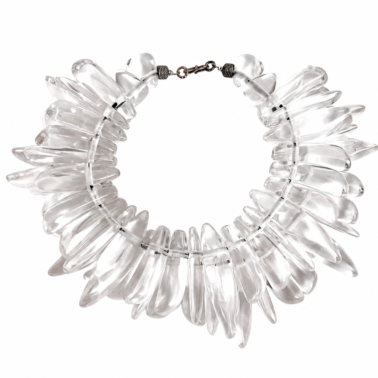 Handcrafted Clear Sculptural Bead Necklace featuring elongated transparent acrylic beads arranged in a circular formation with a metallic clasp. Displayed on a white background, highlighting its luminous, modern design and artistic structure.