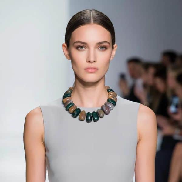 Known as the eternity stone, Indian Agate carries a lunar charge that gives each bead a quietly profound presence.  Polished by hand and matched for tone, every bead in this necklace is individually knotted so it moves and rests comfortably against the skin. The earthy palette—warm russets, mossy greens, soft creams—catches light with a natural luster that changes as you do, bringing an organic elegance to both casual and refined looks.  Wear it alone as a subtle talisman or layer it with other pieces to build depth and meaning.  Each bead is crafted to highlight the stone’s story: ancient symbolism, quiet strength, and a connection to the cycles of nature.  Meticulous knotting protects the beads and ensures durability for years of wear. This piece makes a thoughtful gift for someone who values craftsmanship and soulful design, or a grounding addition to your own collection.  This timeless accessory invites touch and attention without shouting.  Celebrate continuity and the beauty of the natural world with a necklace that feels like a small, wearable ritual.  Indian Agate frames the heart and completes an outfit with understated confidence.  Indian Agate.  Handmade in small batches to preserve quality and intentional energy always.