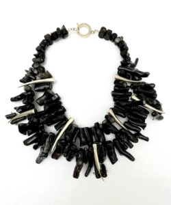 A unique style of three strands black coral beads with 18K gold metal tooth shaped beads