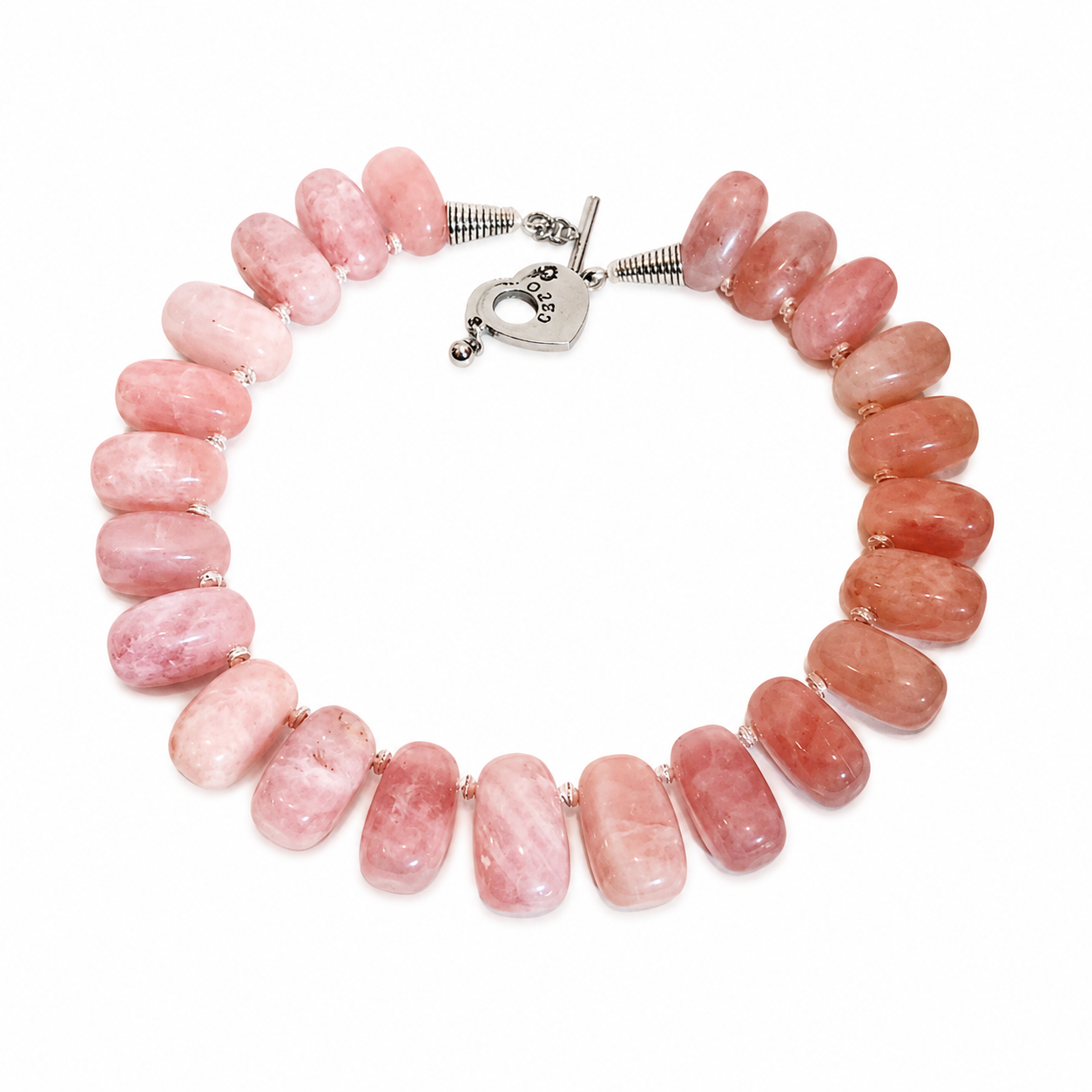 Handcrafted necklace featuring large polished Rose Quartz beads in soft pink hues, accented by a sterling silver heart‑shaped clasp engraved “Caro.” Displayed on a white background.