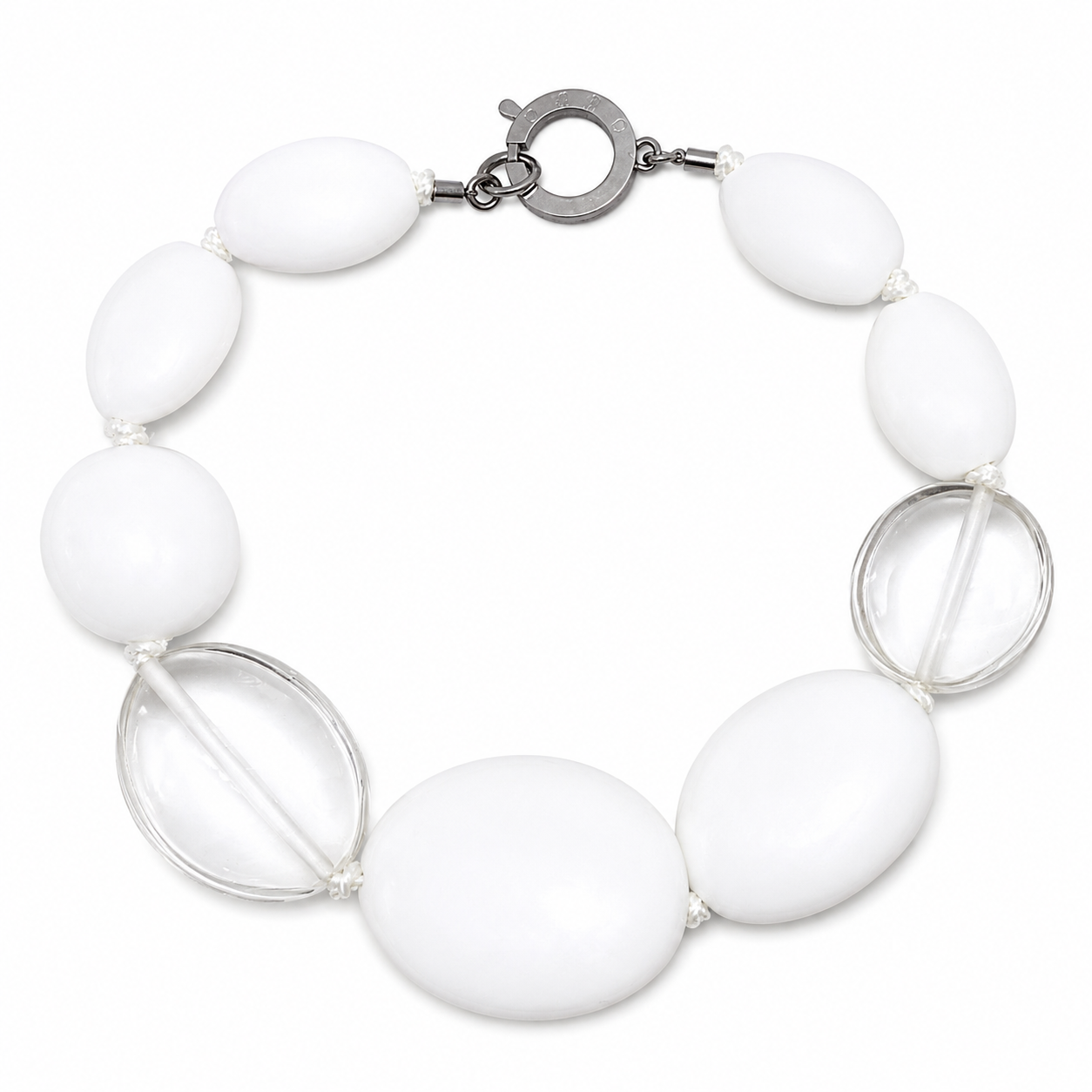 Handcrafted Matte White & Clear Bead Statement Necklace featuring large oval matte white acrylic beads and two clear accent beads, connected by a silver circular clasp engraved “Caro.” Displayed on a white background, highlighting its modern, minimalist design and balanced composition.