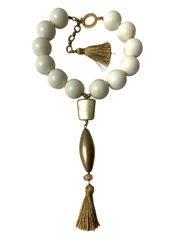 Exotic ivory color round acrylic beads with matt gold pendant. You can wear it as a choker or elongate it up to 18 1/2 inches.