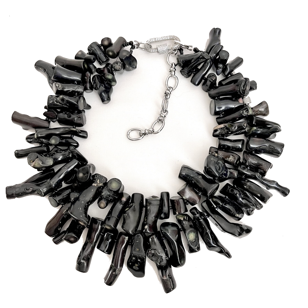 Handcrafted Black Coral Necklace composed of irregular polished black coral branches with a silver clasp and adjustable chain. Displayed on a white background, emphasizing its organic texture, glossy finish, and artisanal craftsmanship.