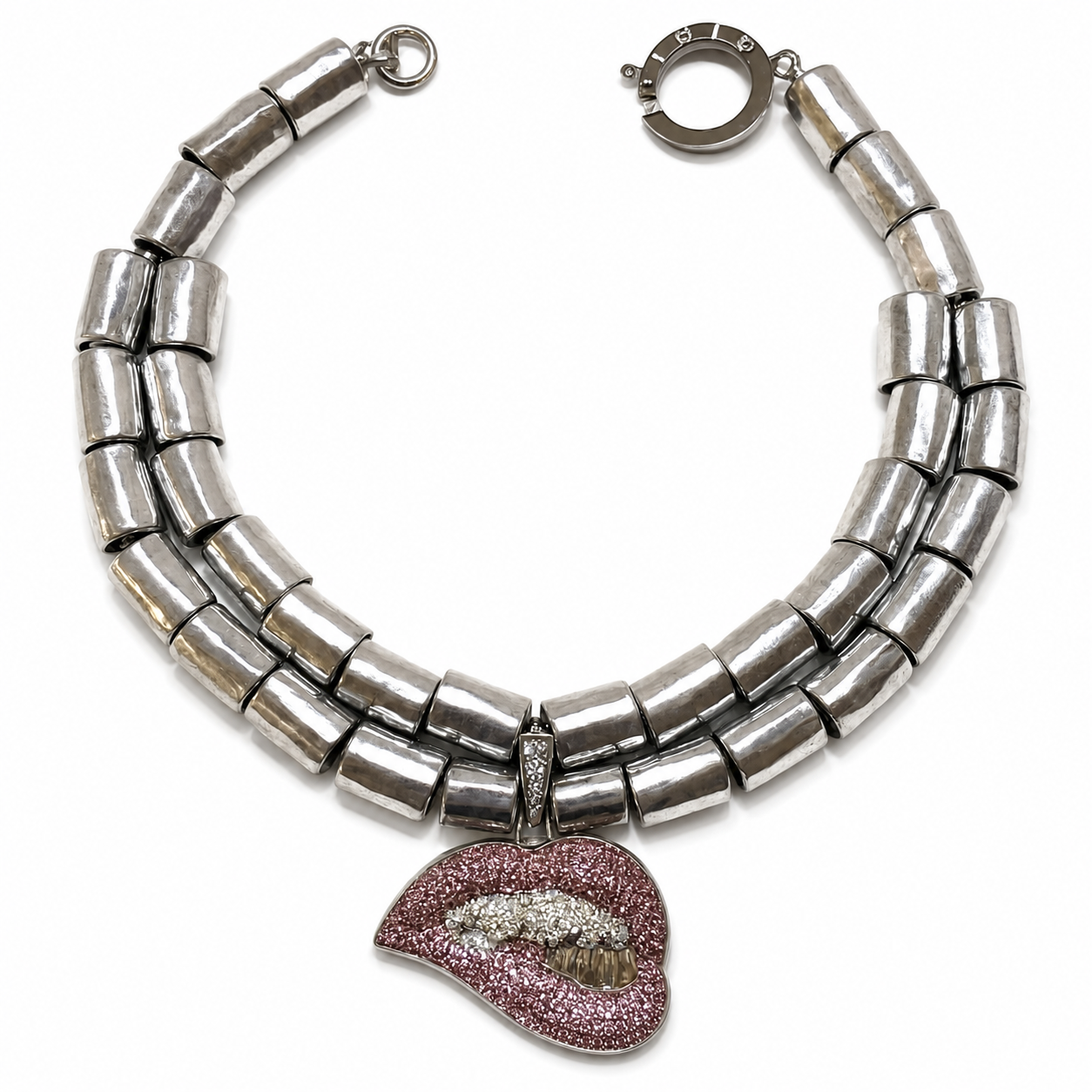 Double‑strand silver choker necklace featuring large cylindrical metallic beads and a pink rhinestone lip pendant with crystal teeth detail.