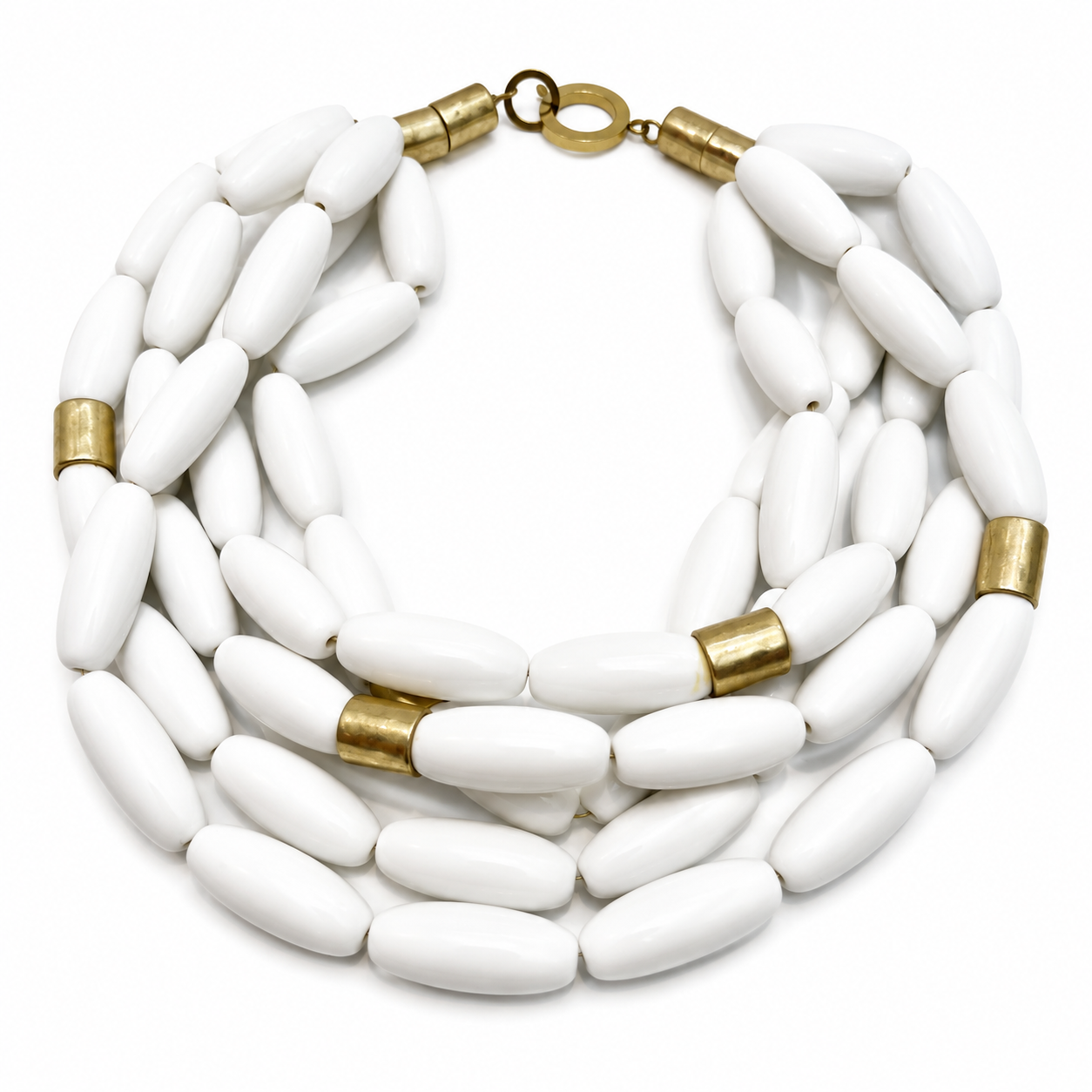 Multi‑strand necklace featuring smooth oval white beads interwoven with cylindrical gold spacers, arranged in layered strands with a gold clasp on a white background.