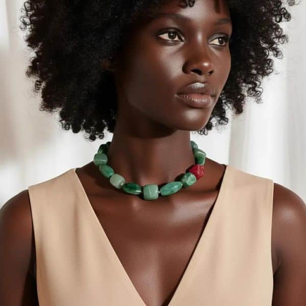 Gracefully understated with a vibrant twist, the Aventurine & Pink Agate Minimalist Choker brings refined color play to modern jewelry design. This exquisite choker is crafted with smooth natural Aventurine stones in rich shades of green, known for their fresh vitality and soothing energy. The palette is gently offset by a singular pink Agate accent bead, adding a soft touch of contrast that elevates the entire piece with feminine warmth and visual intrigue. True to the “less is more” philosophy, the design maintains a minimalist silhouette—lean, elegant, and quietly expressive. The choker sits comfortably and close to the neckline, offering a polished look that works equally well with casual ensembles and tailored styles. Its thoughtful composition and clean lines make it an ideal accessory for those who favor subtleties over sparkle, presence over extravagance. Beyond its visual charm, the natural green choker made of stones lends gentle metaphysical benefits. Aventurine is often associated with emotional balance and prosperity, while pink Agate is linked to compassion and inner peace. Together, they create not just a necklace but a wearable moment of harmony. For effortless elegance and a whisper of color, the Aventurine & Pink Agate Minimalist Choker is the piece that lets you express your style—beautifully and simply.