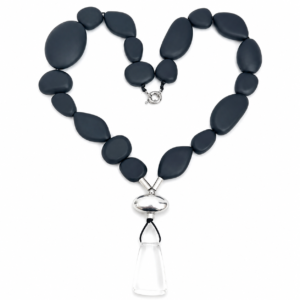 Matte black pebble‑shaped beads with a silver and clear geometric drop pendant, arranged in a sleek single strand.