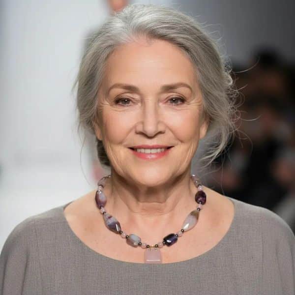 Delicate yet expressive, this sweet pink necklace is a refined celebration of soft tones and intricate natural beauty. Designed for those who appreciate quiet elegance, it features the captivating Botswana Agate—renowned for its subtle banding and harmonious blend of pink and gray hues. These calming tones are mirrored in the pairing of blush-pink Quartz and cool gray Pearls, lending the necklace an air of romantic sophistication. Though petite in size, the pink necklace offers a wealth of detail. The Botswana Agate’s intricate patterns provide visual depth, while each element contributes texture and grace. A charming pink Agate handbag pendant serves as a playful accent that elevates the minimalist silhouette. Adding a final note of luxury, a striking gold charm completes the design with a polished touch. Measuring with comfort and style in mind, this pink necklace is ideal for layering or wearing solo to draw subtle attention. It’s the perfect statement for soft-spoken fashionistas who favor expressive accessories with personality and intention. Whether gifted or chosen for oneself, this necklace brings together modern sensibility and natural artistry in one graceful composition—proof that small treasures often carry the biggest stories.