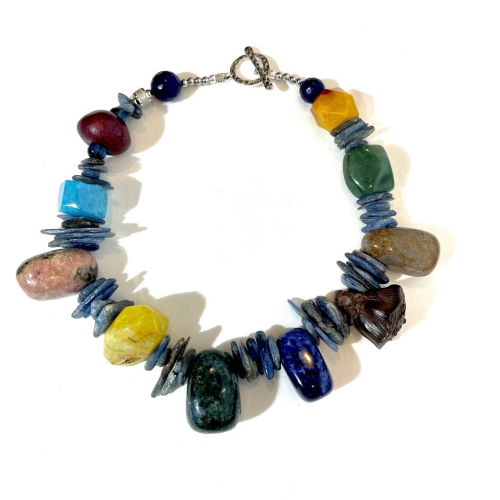 A rich combination of Agate, Kyanite, Wood, Lapilazuli, Rhodonite, Unakite, Boxwood Lotus Pod, and Dragon Bloodstones.