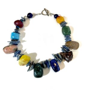 A rich combination of Agate, Kyanite, Wood, Lapilazuli, Rhodonite, Unakite, Boxwood Lotus Pod, and Dragon Bloodstones.