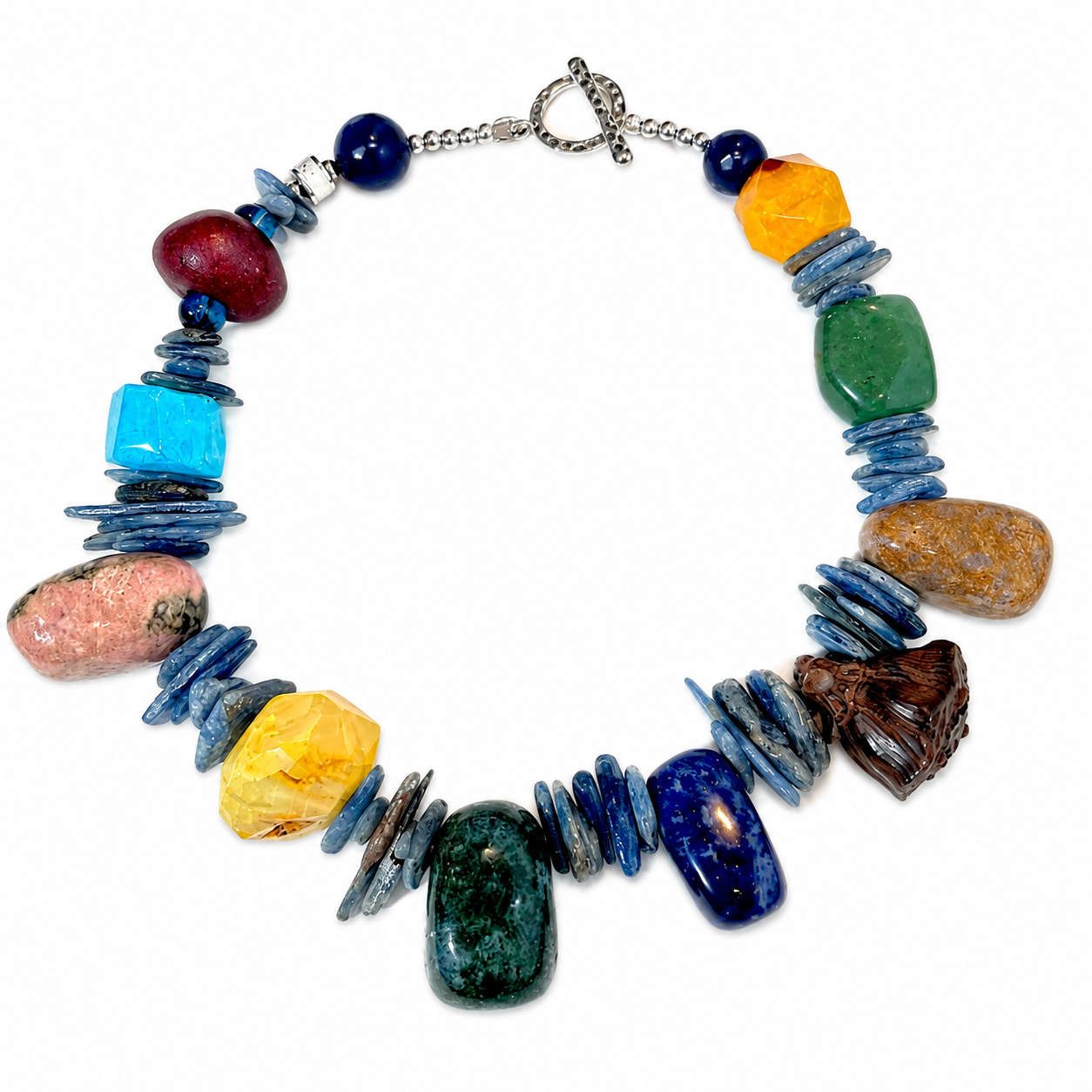 Colorful Lotus Necklace featuring natural stones including Agate, Kyanite, Wood, Sodalite, Rhodonite, Unakite, Dragon Bloodstone, and a carved Boxwood Lotus Pod centerpiece with silver clasp.