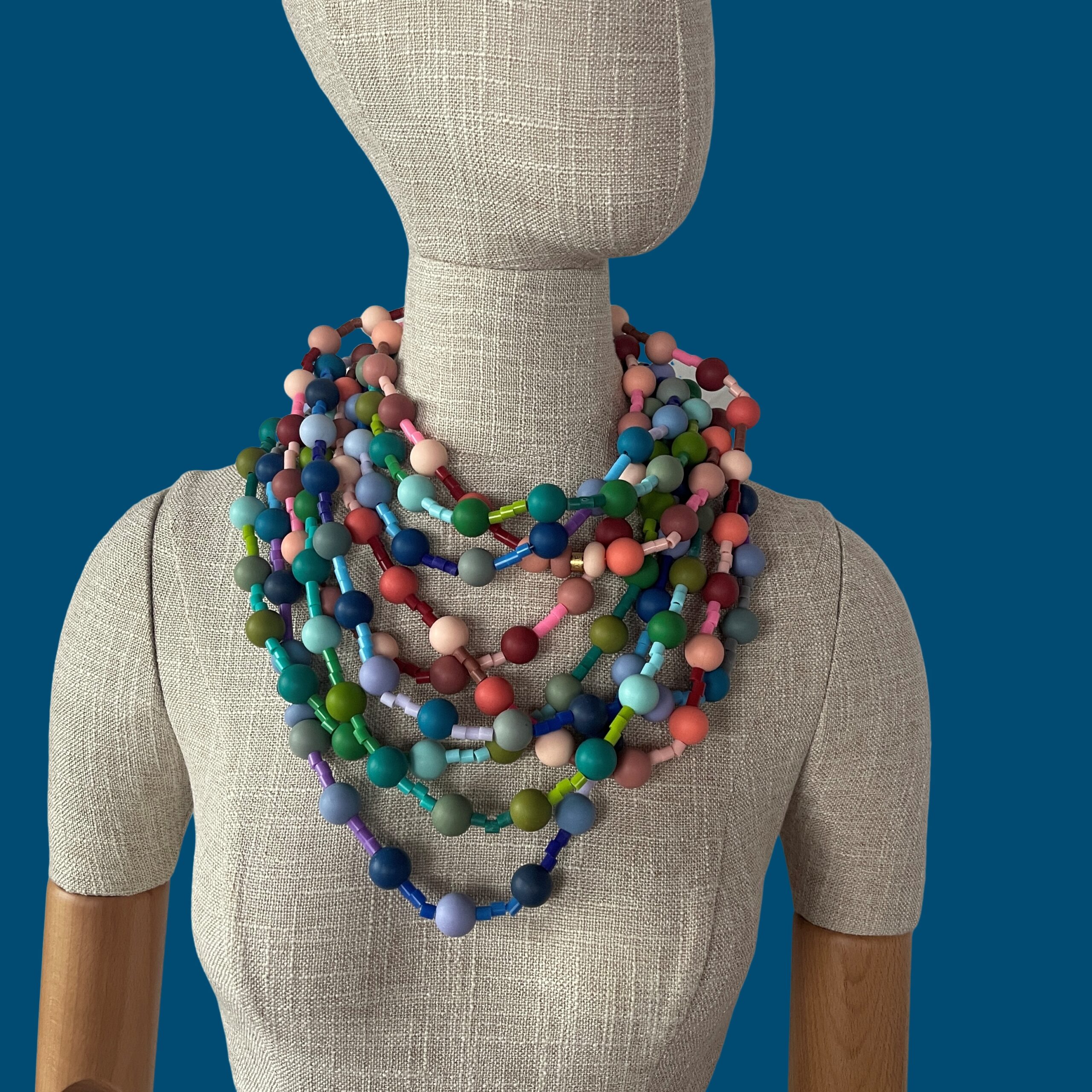 Add effortless charm to your everyday style with this elegant set of blue long necklace combo, designed to blend comfort, durability, and eye-catching simplicity. Each necklace measures 37 inches in length and features soft, silky silicone beads in delicate pastel hues—blue, peach, and green—creating a trio that’s both soothing and stylish. The blue long necklace combo is lightweight design, these necklaces offer all-day comfort without compromising sophistication. The smooth silicone beads provide a gentle, modern aesthetic that’s perfect for casual wear, yet refined enough to elevate a weekend brunch look or a breezy work ensemble. This set is suitable to be in contact with water without damaging the beads.  The extra-long length allows versatile styling—wear one solo for a minimalist statement or layer all three for a vibrant, contemporary stack. Built with high-quality materials, each necklace in the set of the blue long necklace is crafted to last, offering longevity that matches its timeless appeal. Whether you’re curating your own jewelry collection or gifting to someone who loves thoughtful accessories, this set is a beautiful balance of form and function. From soft pastel tones to its refined silhouette, this trio delivers style that feels as good as it looks—an easy favorite for daily wear with an understated elegance that speaks for itself.