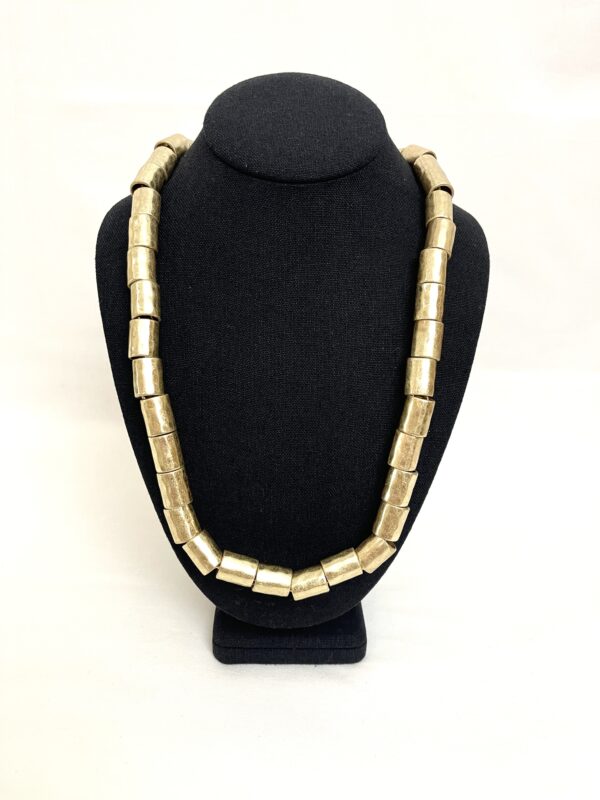 A softer punk style.  Antique gold cylindrical beads.  Long style necklace measuring 33 INC/84 MM.  