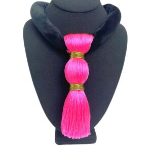 Bold, playful, and effortlessly chic—this striking pink and black necklace is the accessory your black wardrobe’s been waiting for. Measuring 17 inches (43 cm) and weighing a mere 3 ounces, it blends comfort with unforgettable style. The soft black suede cord lies smoothly against the skin, while the oversized hot pink tassel, crafted from luxe silk thread and bound in shimmering gold, steals the spotlight. Perfect for those who love wearing black but want to add a vibrant twist, the tassel’s vivid hue injects instant energy into your ensemble. Whether you're dressing up a casual tee or adding flair to an evening look, this piece is a standout companion. The tassel sways gracefully with movement, catching the light and attention alike—making it more than an accessory; it’s a statement of joyful confidence. Designed for effortless wear, its lightweight construction and punchy color palette make it ideal for both day-to-night transitions and seasonal layering. A must-have in any expressive collection, this necklace invites you to redefine black with a pop of personality. Let it hang loose, speak loud, and celebrate your style with every swing.