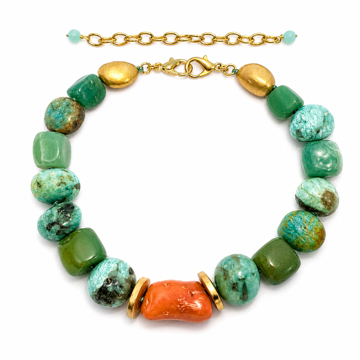 Handcrafted necklace displayed on a black stand, featuring large polished amazonite stones in shades of green and turquoise with natural marbling. A single reddish-orange stone serves as the centerpiece, flanked by gold-toned spacer beads that add warmth and contrast.