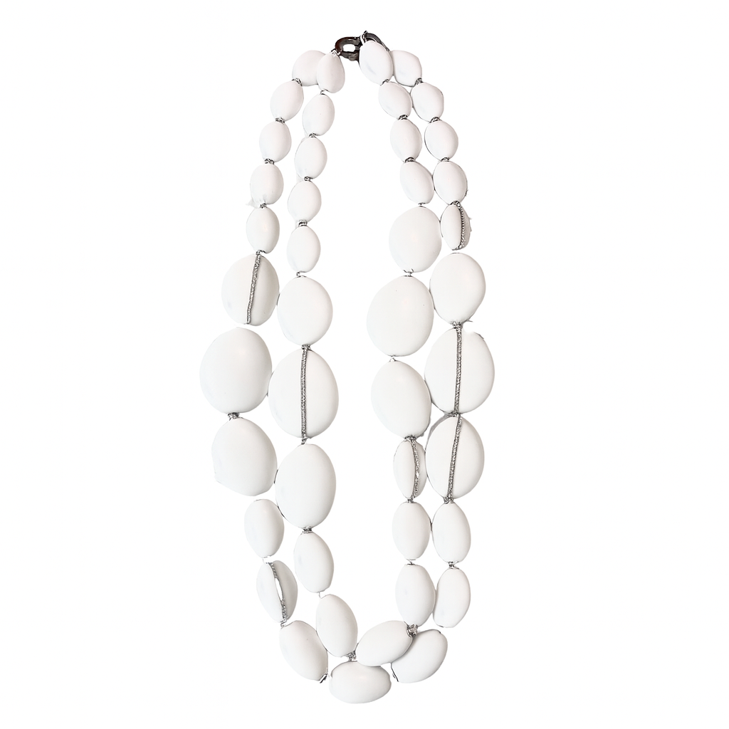 Double-strand necklace composed of smooth, oval-shaped white beads of varying sizes, connected by thin silver spacers. The beads are arranged symmetrically, creating a polished and elegant design with a soft, luminous finish.