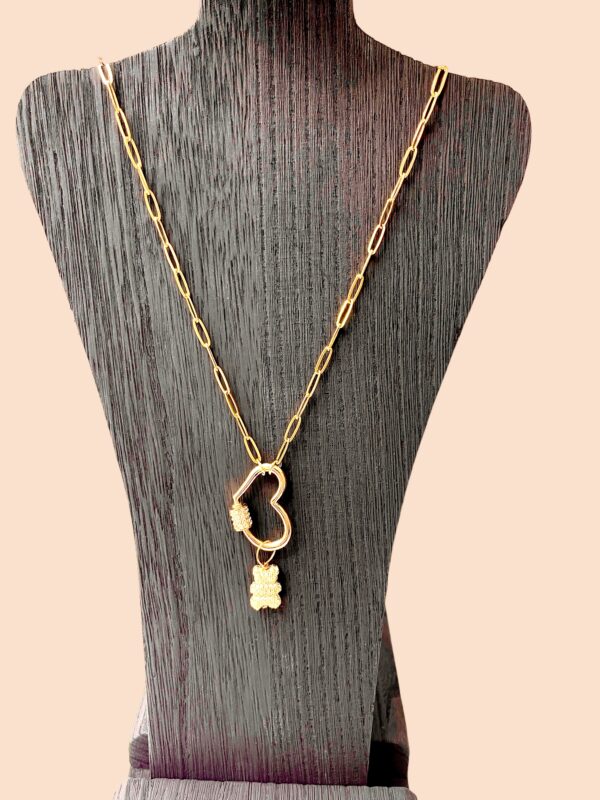 Oval links, 14K gold plated chain with a gold heart carabiner-style clasp, and teddy bear removable charm.  The chain is 23IN/53CM/1OZ, extending up to 23 inches.