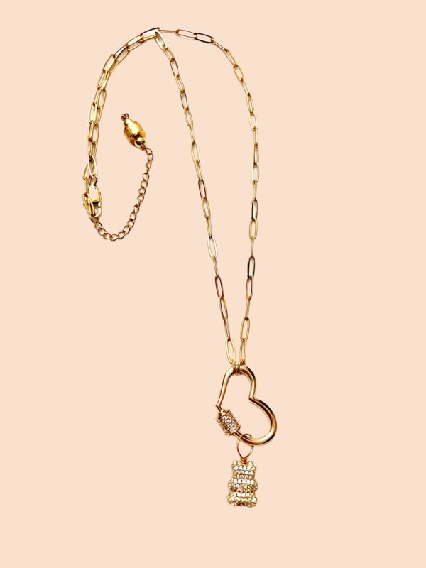 Oval links, 14K gold plated chain with a gold heart carabiner-style clasp, and teddy bear removable charm.  The chain is 23IN/53CM/1OZ, extending up to 23 inches.