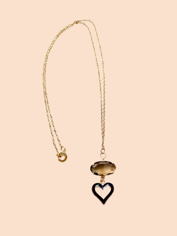 The Valentine Heart and the Chrystal are gold in color and are in an 18K gold-plated chain and clasp.  The chain measures 19.5IN/50CM/1OZ.  A delicate and sophisticated look for the one you love.