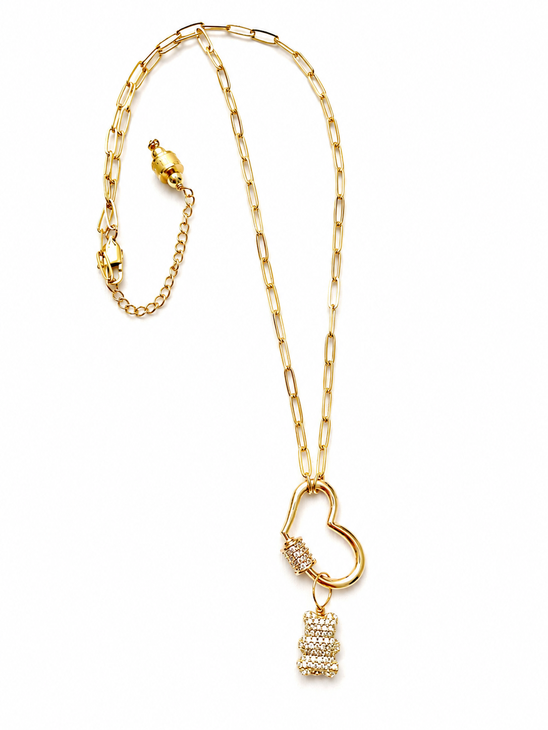 Gold chain necklace featuring interlinked oval and twisted loops with several sparkling charms. The charms include bear-shaped pendants in silver, blue, purple, and gold tones, along with a glittery silver heart and a small cylindrical gold charm near the clasp.