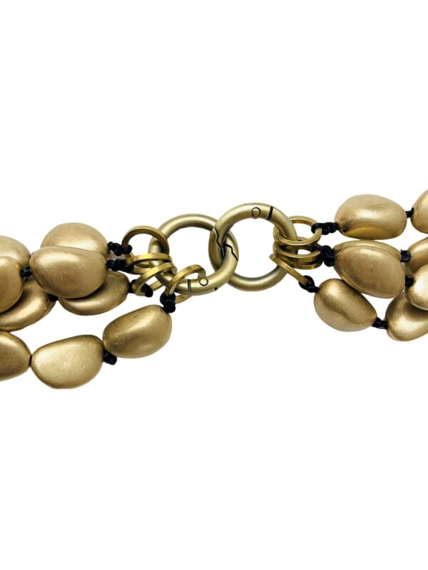 This versatile four-strand necklace can be detached and worn alone or in combination.  The beads are oval in antique gold, and the clasp is two carabines for easy opening and closing.  The longest strand is 42 inches; combined strands weigh 32 ounces.  Wearing all four strands makes a showpiece, and wearing only one makes a unique look.  You can order one strand at no additional cost and specify the length.