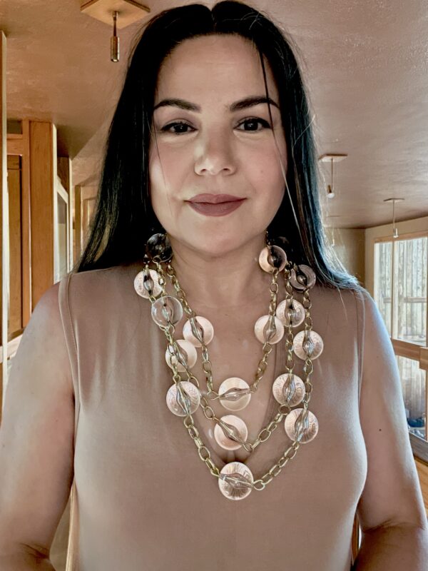 It's super long and super fun. This extra-long necklace has a gold chain linking large clear beads; it is easy to wear with any color, formal or informal. The necklace measures 81IN/16OZ, and you can wear it long or in multistrands as a collar necklace. 