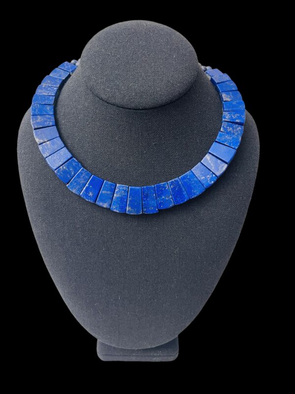 Polished, genuine Lapis Lazuli necklace. It measures 17 IN/3 OZ.  The center bead measures 21 mm.