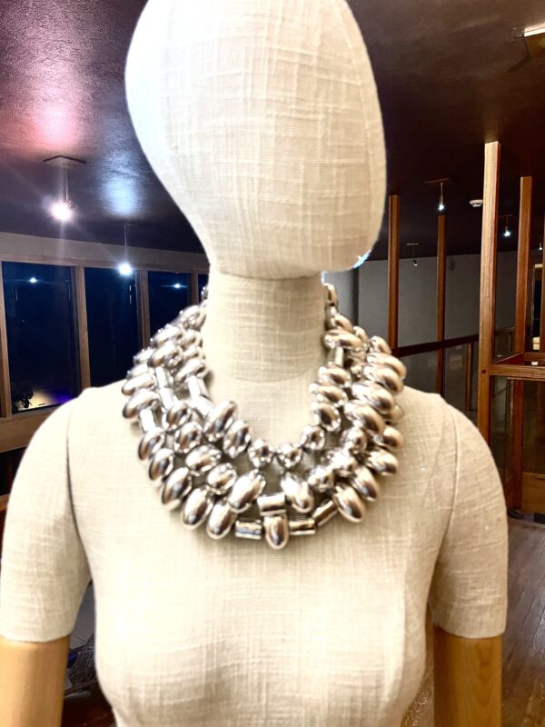 Sophisticated and elegant display of silver oval-shaped beads. You can wear the necklace with casual or formal attire in one, two, or even three strands. The necklace necklace measures 65 IN/20 OZ. The necklace will show extra cord to make the neck curve if you wear it in multiple layers.