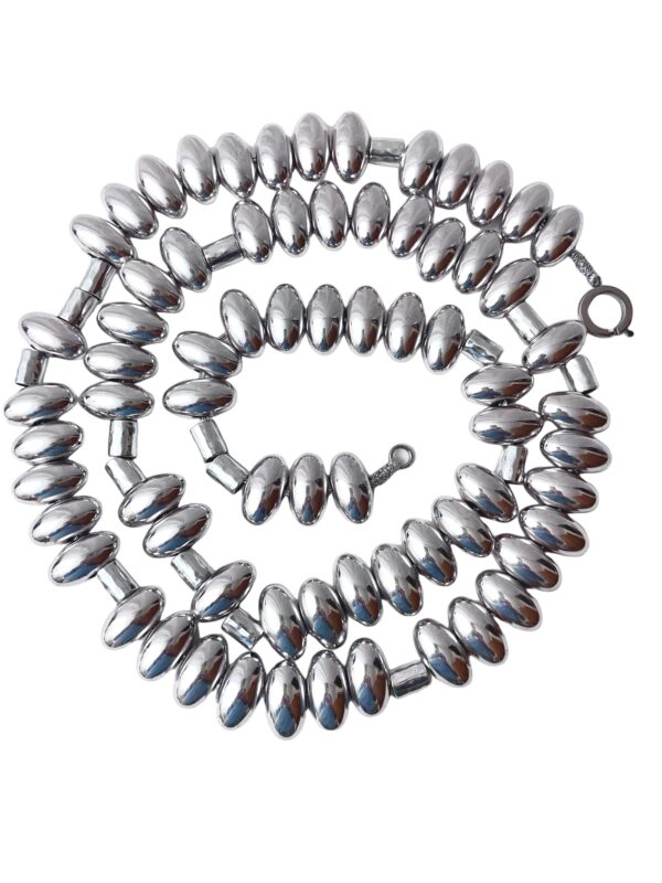 Sophisticated and elegant display of silver oval-shaped beads. You can wear the necklace with casual or formal attire in one, two, or even three strands. The necklace necklace measures 65 IN/20 OZ. The necklace will show extra cord to make the neck curve if you wear it in multiple layers.