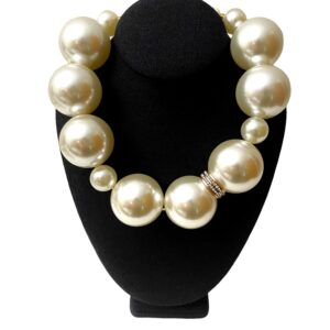 Statement necklace of oversized simulation pearls. A distinctive look with a one-of-a-kind choker necklace. The size of the beads makes the necklace elegant for night-time and fun for day-time. The necklace measures 20 IN/10 OZ.