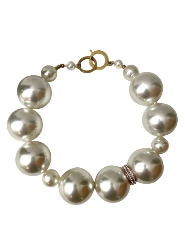 Statement necklace of oversized simulation pearls. A distinctive look with a one-of-a-kind choker necklace. The size of the beads makes the necklace elegant for night-time and fun for day-time. The necklace measures 20 IN/10 OZ.