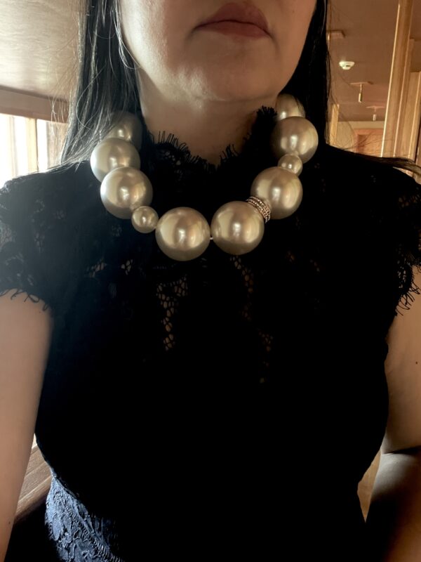 Statement necklace of oversized simulation pearls. A distinctive look with a one-of-a-kind choker necklace. The size of the beads makes the necklace elegant for night-time and fun for day-time. The necklace measures 20 IN/10 OZ.