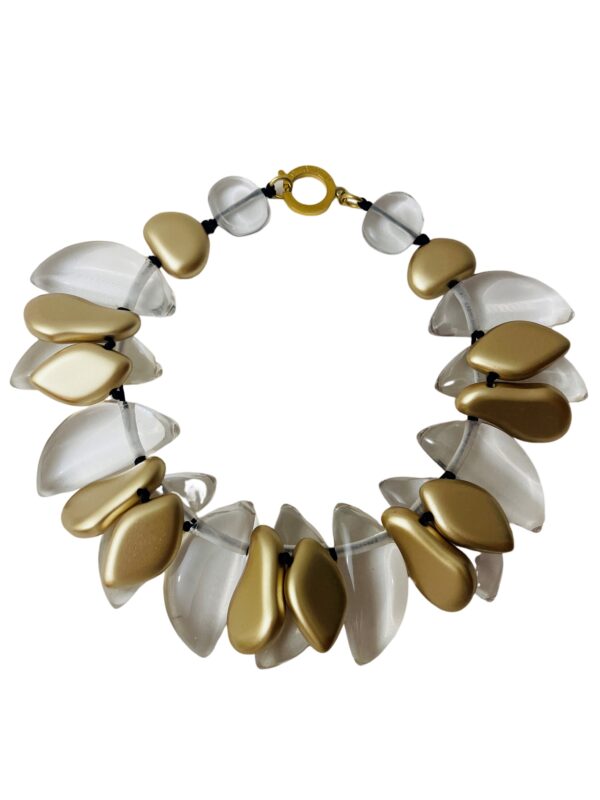 Large clear and gold leaf-shaped beads cluster into one strand. This statement necklace is for day or night. It measures 20IN/15OZ.