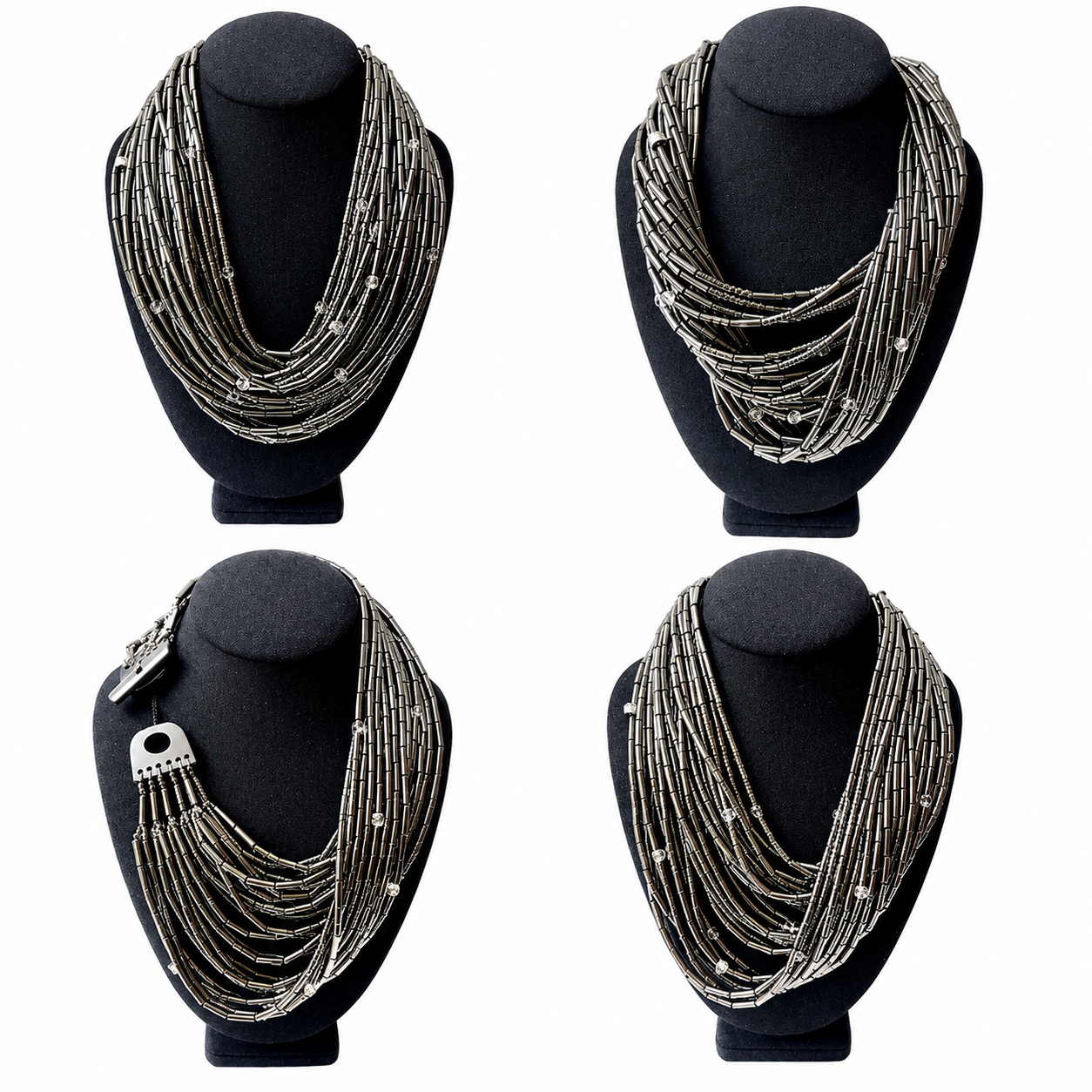 Close-up of the Hematite Necklace displayed on a dark mannequin bust. The necklace features 24 strands of metallic hematite tubes interspersed with small faceted crystals, creating a layered, shimmering effect. A silver-toned toggle clasp adds a sculptural finish.