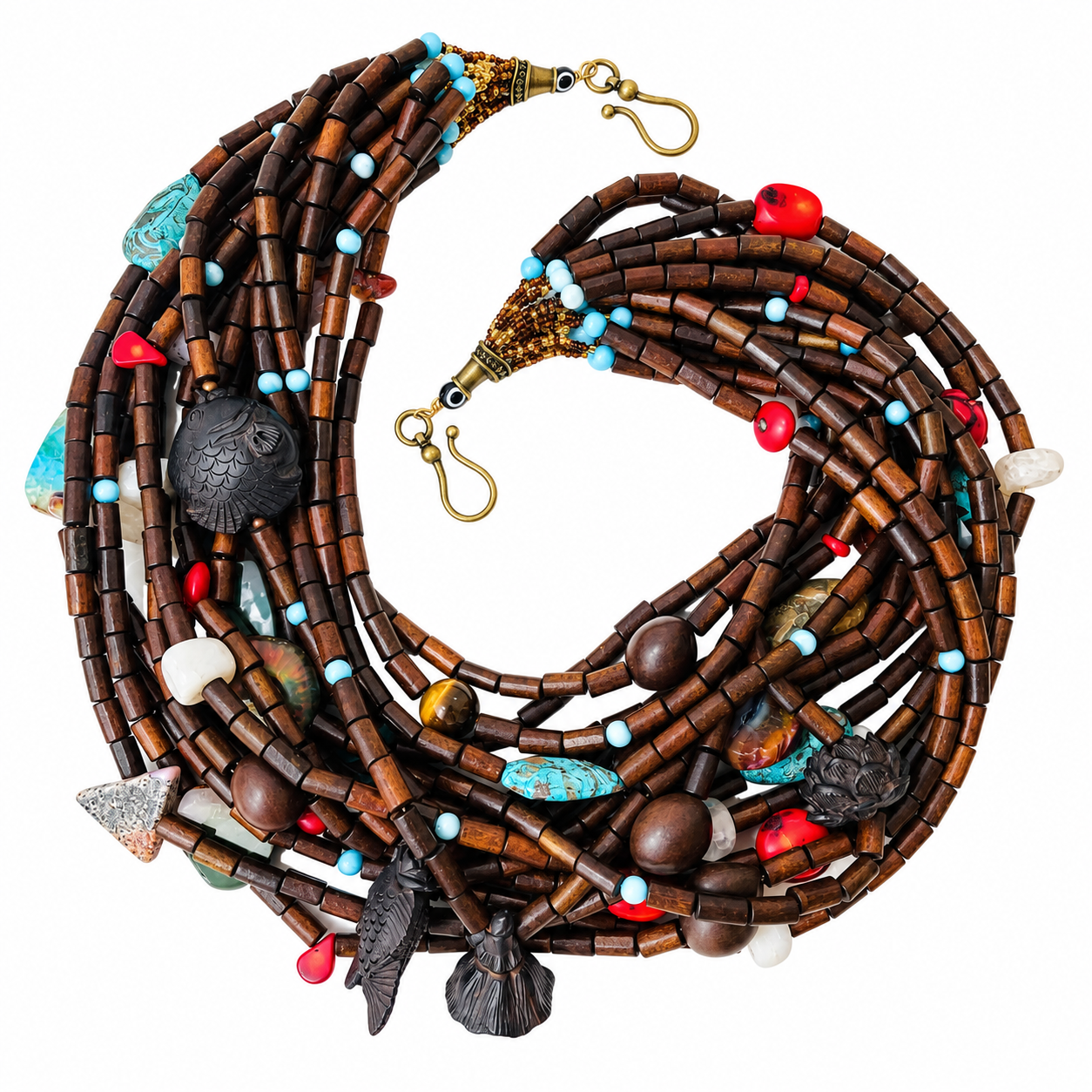Calypso Necklace featuring multi‑strand brown wood beads with turquoise, coral, agate, and carved fish and lotus charms symbolizing prosperity and resilience.