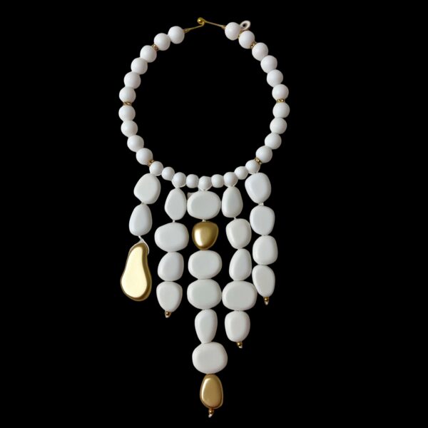 The choker measures 16 IN, and the longest strand of beads measures 28 IN.   The necklace design displays dangling acrylic white beads with gold accent beads.  This is a true white statement necklace that can be formal or informal.  The beads are pure white and stand out easily.  