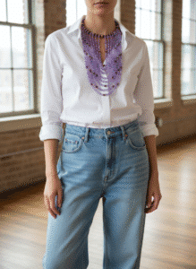 💜 Elegant and expressive, this multi-strand necklace is a tribute to timeless style and vibrant color. With a structure that gracefully transitions from a 16-inch choker to cascading strands reaching 30 inches, it offers layered drama while maintaining a comfortable, fluid silhouette. The necklace is composed of a rich assortment of purple tones, each shade thoughtfully chosen to evoke depth and dimension. Interspersed throughout are brass accent beads that lend warmth and refinement, creating a luxurious contrast against the cooler palette. These metallic touches add subtle shimmer while anchoring the design with polished elegance. At the front, the beads are meticulously arranged to form a stable focal point, ensuring both balance and visual impact. Among the carefully selected materials are glass beads whose glossy finish elevates the overall texture. These glass beads not only amplify light reflection but also contribute to the necklace’s sophisticated rhythm. A third reference to glass beads underscores their integral role in the composition, offering continuity without overstatement. Ideal for both casual and formal occasions, this necklace moves easily from daywear to evening refinement. Its multi-strand form and intentional color play make it a standout statement piece. Let it frame your neckline with confidence and artistry—an embodiment of modern charm and enduring grace.