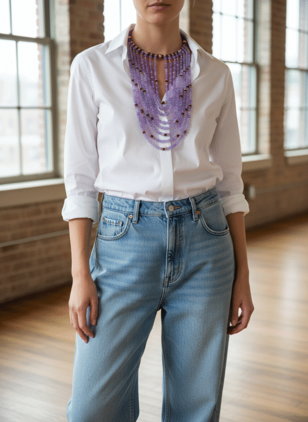 💜 Elegant and expressive, this multi-strand necklace is a tribute to timeless style and vibrant color. With a structure that gracefully transitions from a 16-inch choker to cascading strands reaching 30 inches, it offers layered drama while maintaining a comfortable, fluid silhouette. The necklace is composed of a rich assortment of purple tones, each shade thoughtfully chosen to evoke depth and dimension. Interspersed throughout are brass accent beads that lend warmth and refinement, creating a luxurious contrast against the cooler palette. These metallic touches add subtle shimmer while anchoring the design with polished elegance. At the front, the beads are meticulously arranged to form a stable focal point, ensuring both balance and visual impact. Among the carefully selected materials are glass beads whose glossy finish elevates the overall texture. These glass beads not only amplify light reflection but also contribute to the necklace’s sophisticated rhythm. A third reference to glass beads underscores their integral role in the composition, offering continuity without overstatement. Ideal for both casual and formal occasions, this necklace moves easily from daywear to evening refinement. Its multi-strand form and intentional color play make it a standout statement piece. Let it frame your neckline with confidence and artistry—an embodiment of modern charm and enduring grace.
