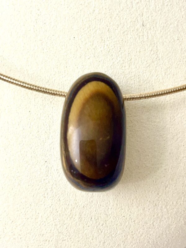 Tiger Eye: The stone resembles a tiger's eye, with brown and yellow colors.  It was used in the 1800s to protect against the evil eye and is today highly used in litho therapy.