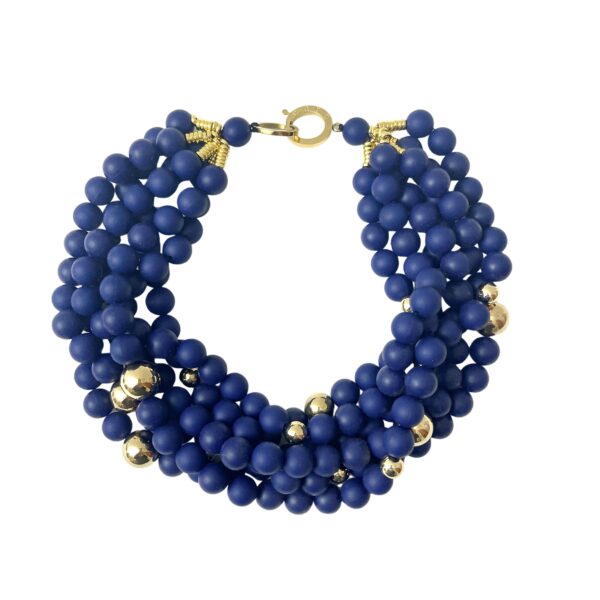 This exquisite blue beaded necklace features navy blue silicone beads interspersed with elegant gold accent beads, creating a striking and exotic design. Perfect for making a bold statement, this necklace is visually appealing and versatile enough to complement various outfits. Elevate your accessory collection with this eye-catching piece that is sure to turn heads.