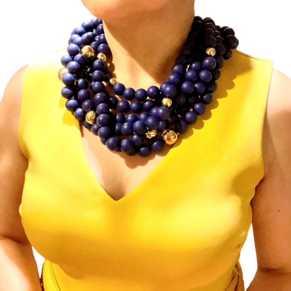 This exquisite blue beaded necklace features navy blue silicone beads interspersed with elegant gold accent beads, creating a striking and exotic design. Perfect for making a bold statement, this necklace is visually appealing and versatile enough to complement various outfits. Elevate your accessory collection with this eye-catching piece that is sure to turn heads.