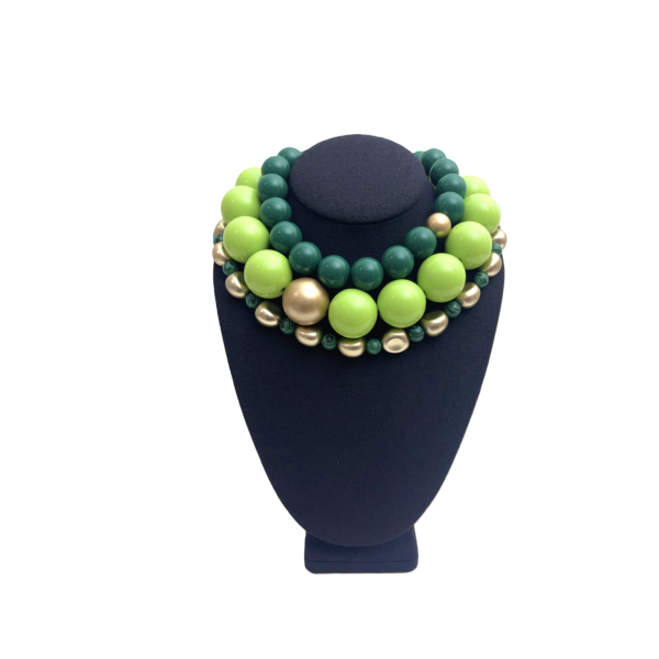 This exquisite triple strand choker necklace showcases a harmonious blend of forest green medium-sized beads, vibrant lime green large beads, and delicate malachite green small beads, all elegantly interspersed with accent gold beads. The design creates a stunning visual display, making it a standout piece that embodies the splendor of greens. Perfect for adding a touch of color with sophistication in both casual and formal occasions. This choker necklace includes an extender; you can wear it at 16 IN and up to 20 IN with the extender. green choker necklace