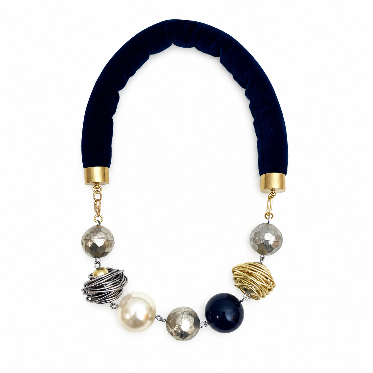 Spaced Beads Necklace featuring black velvet cord with alternating gold, silver, pearl, and black spherical beads in mixed textures.