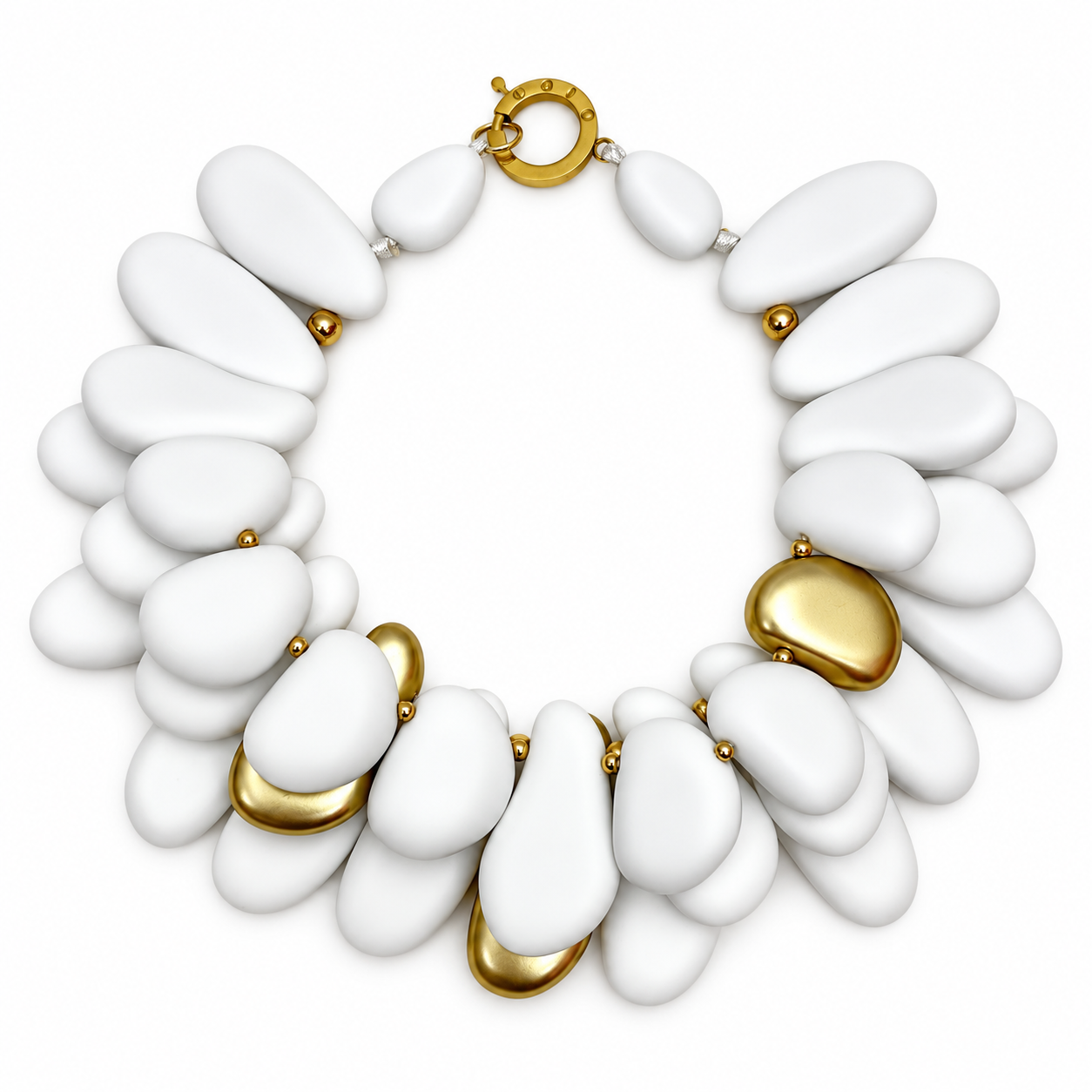 Statement necklace composed of smooth, pebble‑shaped acrylic beads in matte winter white with scattered gold accents, arranged in layered strands and secured with a round gold clasp.
